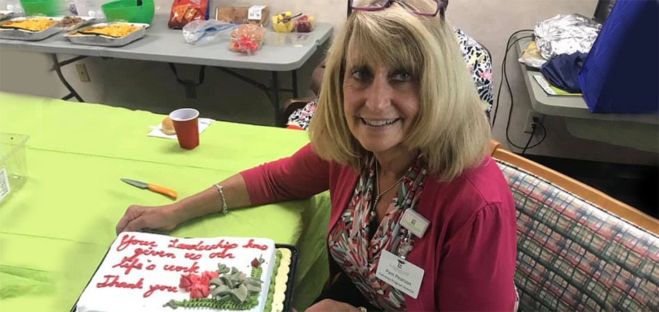 Pam with a congratulations cake